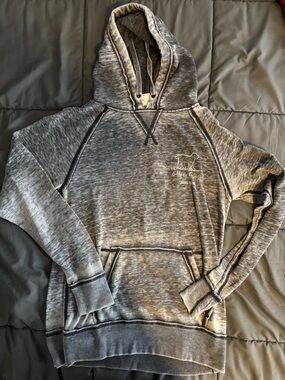 J. America Woman’s Heather Gray Pullover Hoodie with Chest Logo